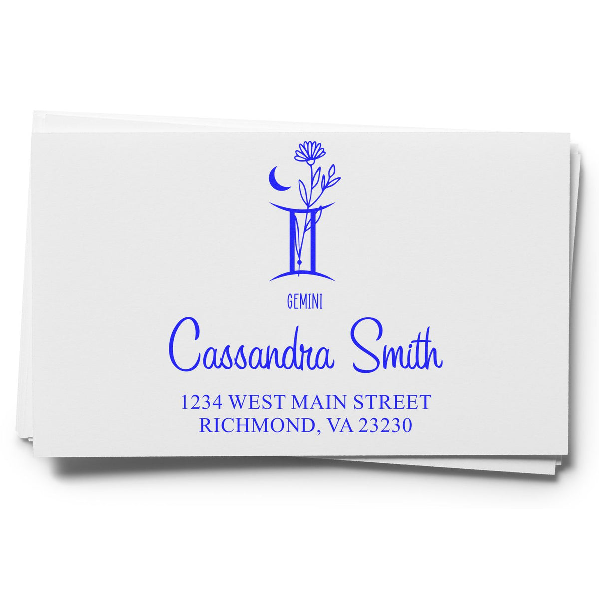 Blue Gemini return address stamp seal with floral icon, Cassandra Smith, and Richmond, VA in blue on white card