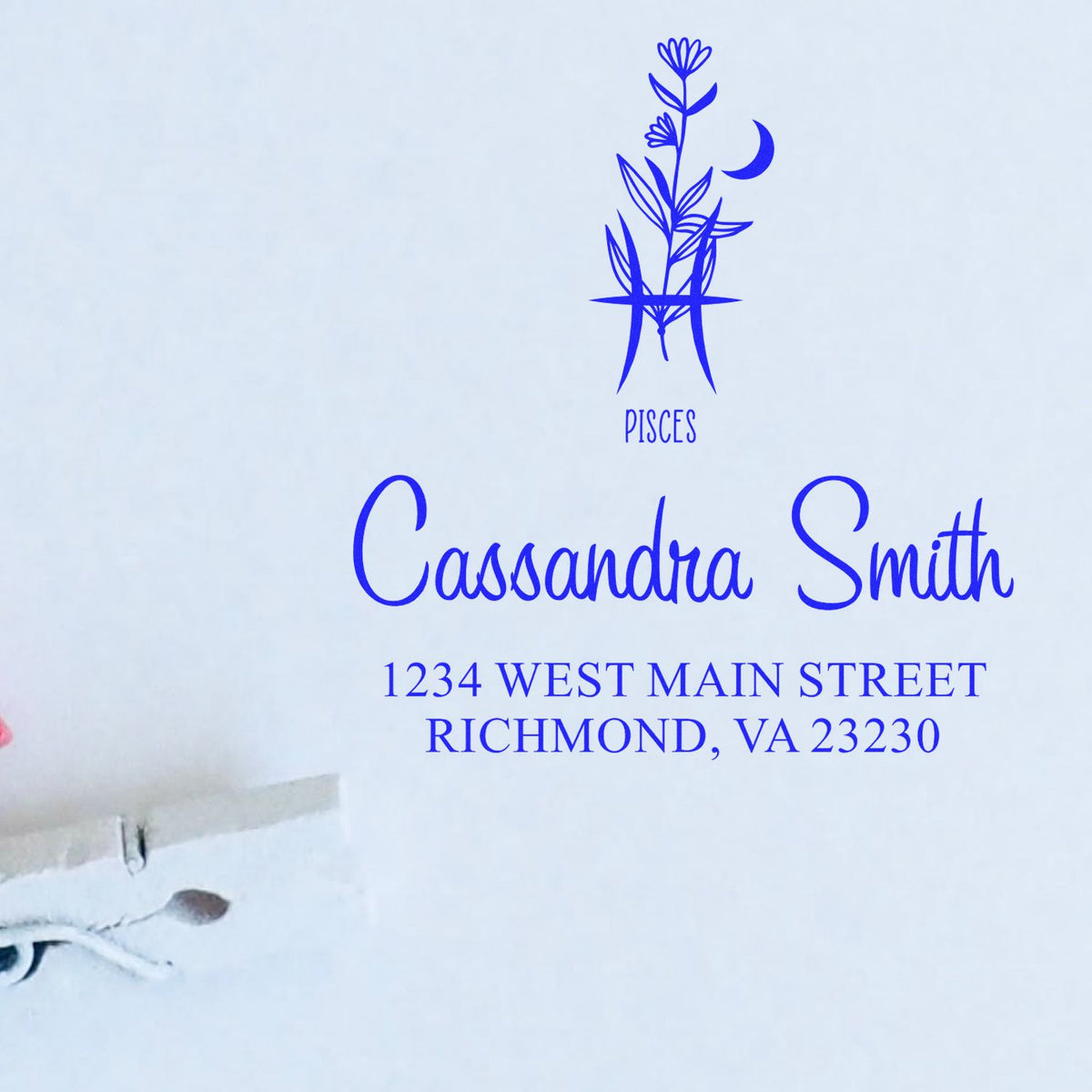 Blue custom stamp seal with Pisces floral emblem, Cassandra Smith name, and Richmond VA address.