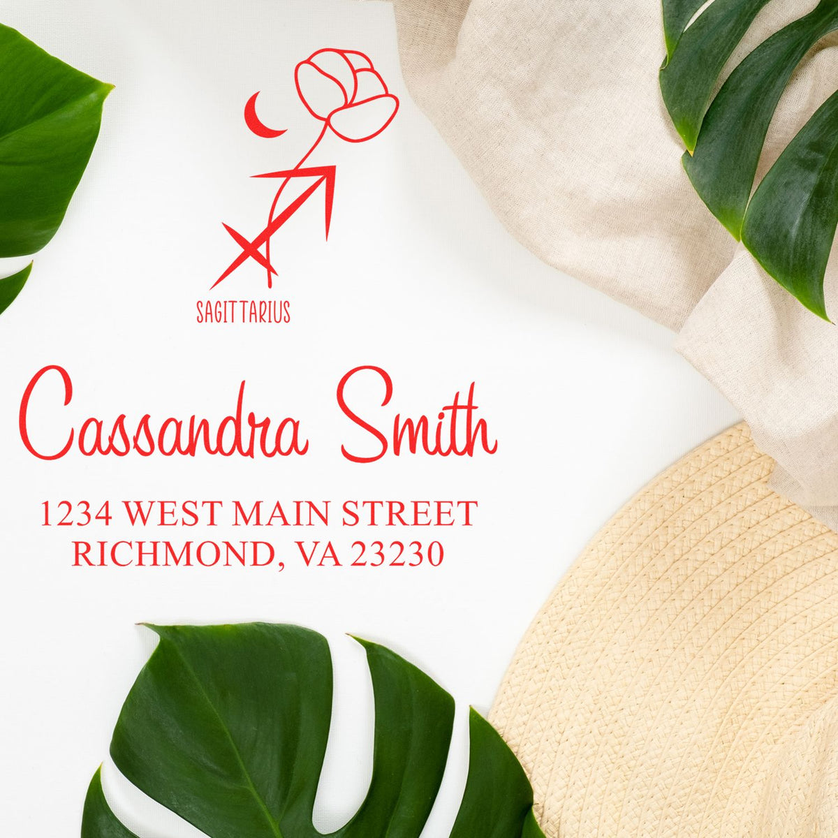 Red Sagittarius custom stamp seal for Cassandra Smith with Richmond address, on white with green leaves.