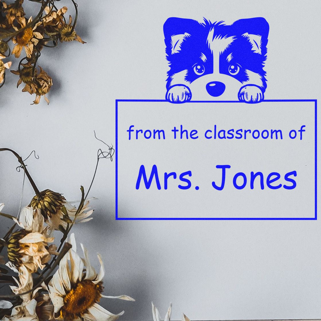 Blue classroom stamp and seal with raccoon graphic and from the classroom of Mrs. Jones text on white background.