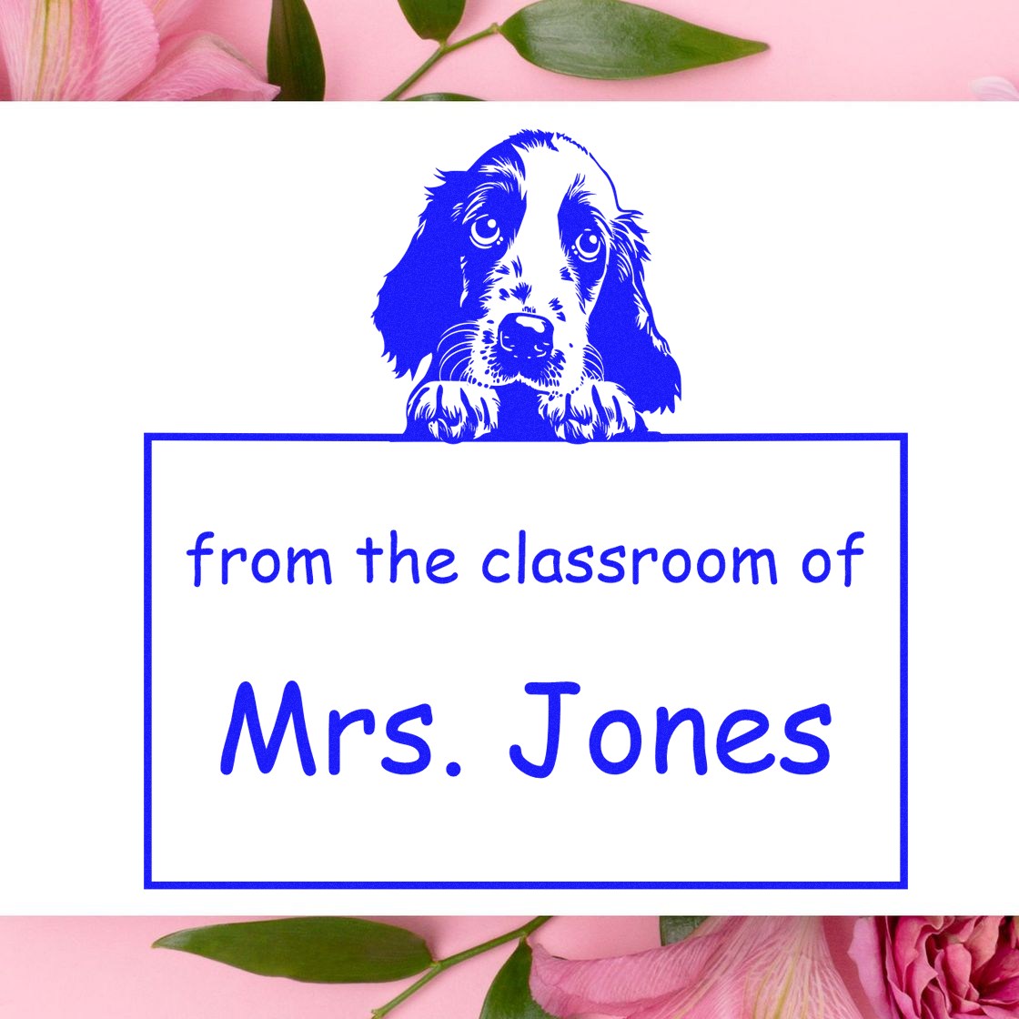 Blue dog-themed self-inking classroom stamp reading from the classroom of Mrs. Jones on white.