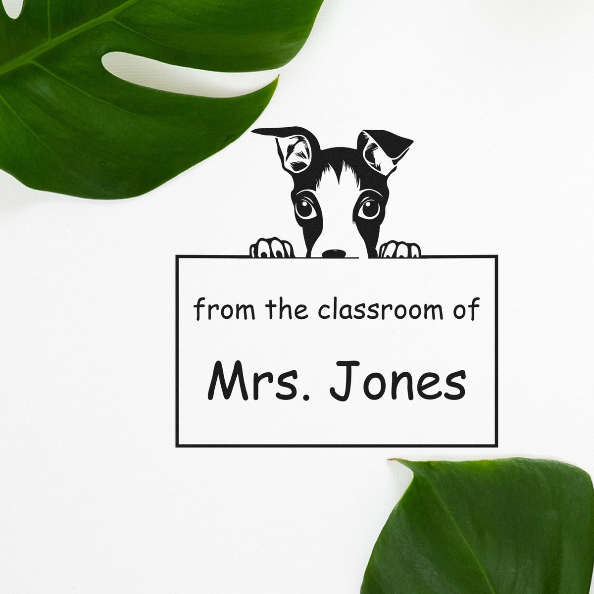 Custom stamp and seal with black dog peeking over a sign reading "from the classroom of Mrs. Jones," on white with green leaves.