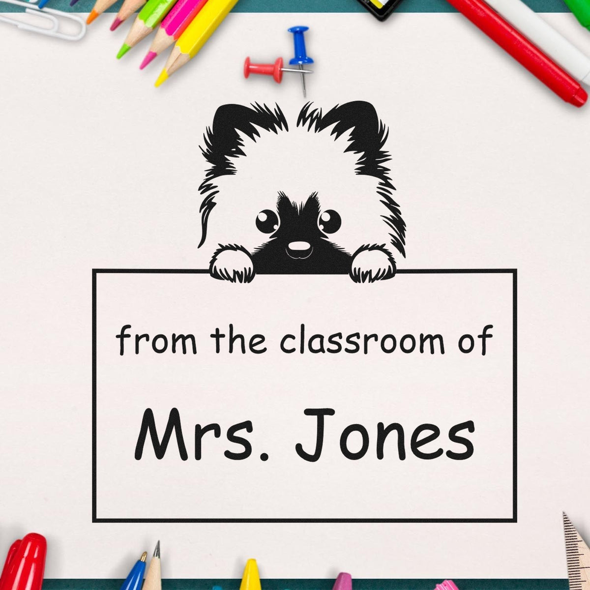 Personalized black classroom stamp and seal with panda mascot, from the classroom of Mrs. Jones, surrounded by colorful pencils.