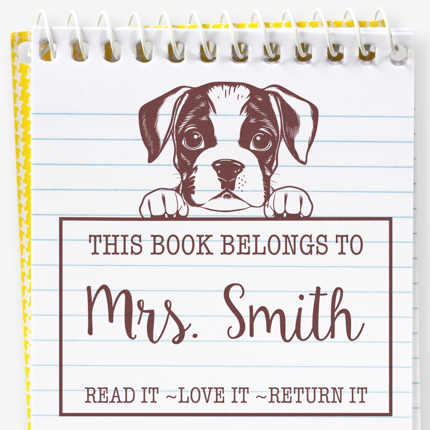 Brown puppy book stamp seal on white lined notebook paper with yellow border and spiral binding, labeled Mrs. Smith.
