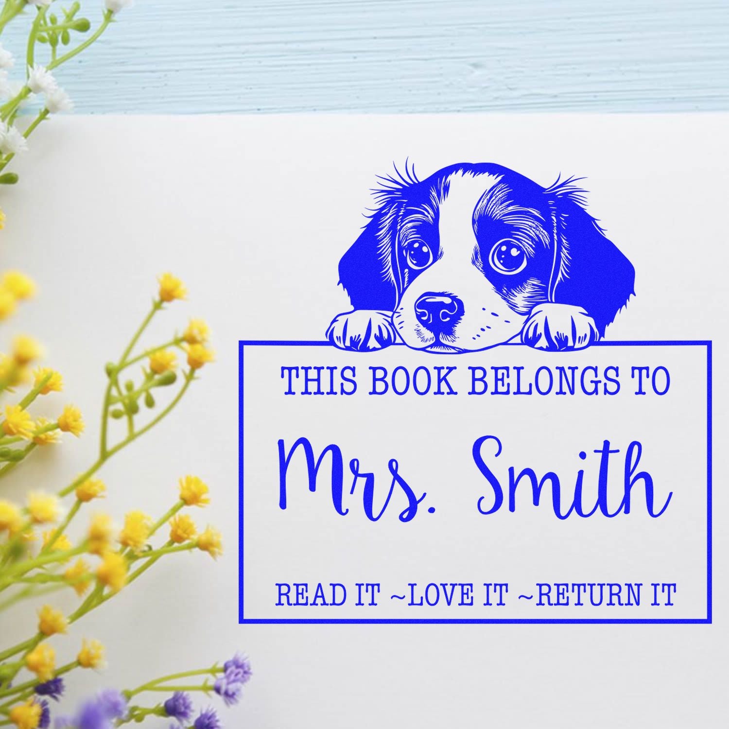 Blue puppy book ownership stamp reading This Book Belongs to Mrs. Smith with Read it, Love it, Return it slogan.