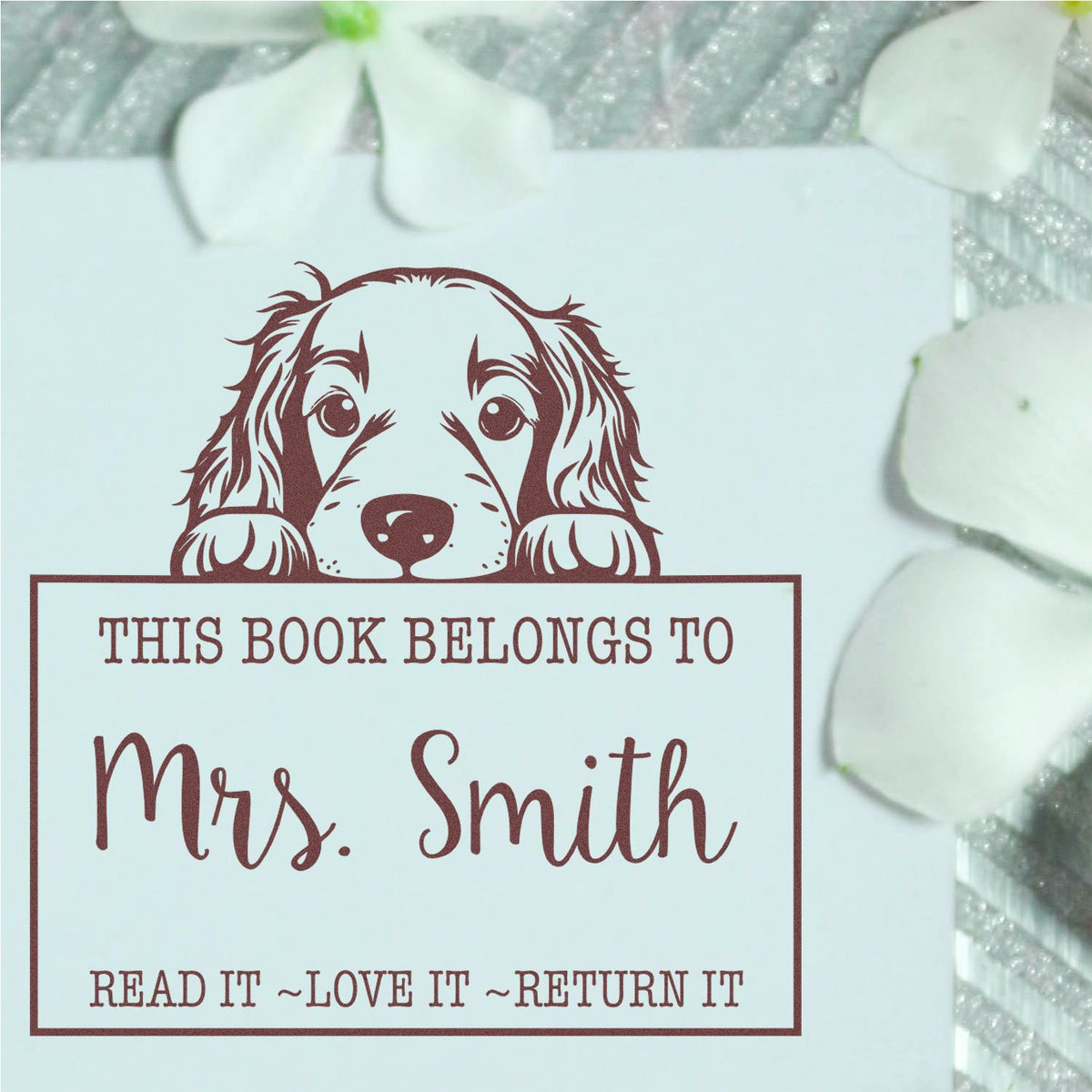 Maroon dog book-belonging stamp and seal reading This Book Belongs to Mrs. Smith with Read it~Love it~Return it on white.