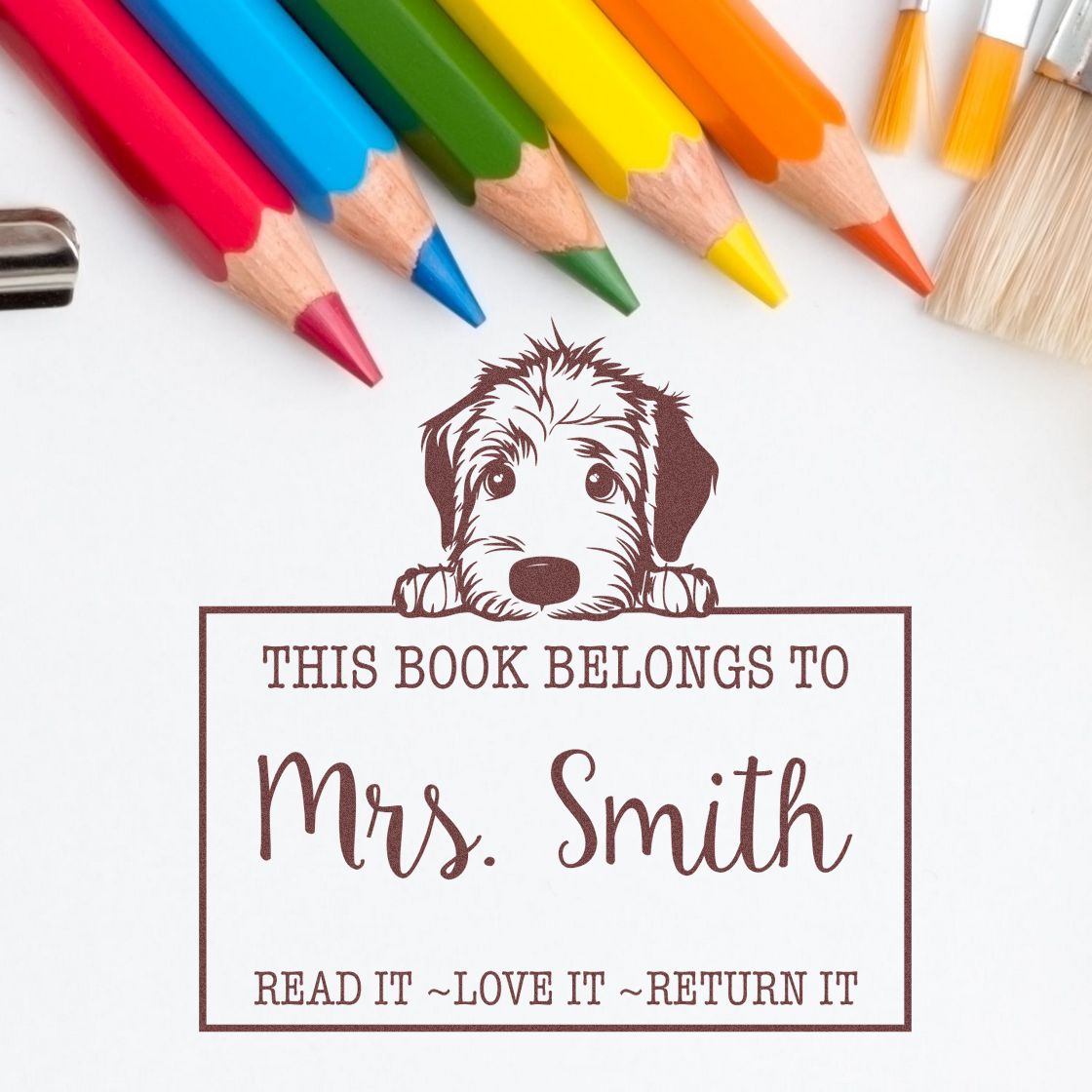 Brown dog book stamp and seal reading This book belongs to Mrs. Smith, with colorful pencils on white background.