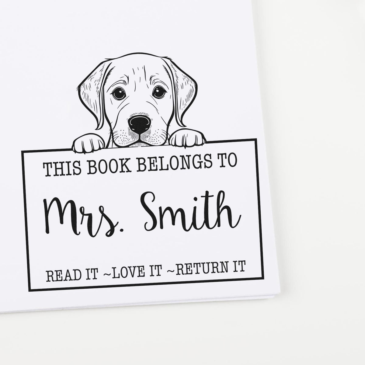 Black-and-white personalized dog book stamp with This Book Belongs to Mrs. Smith and Read it, Love it, Return it.