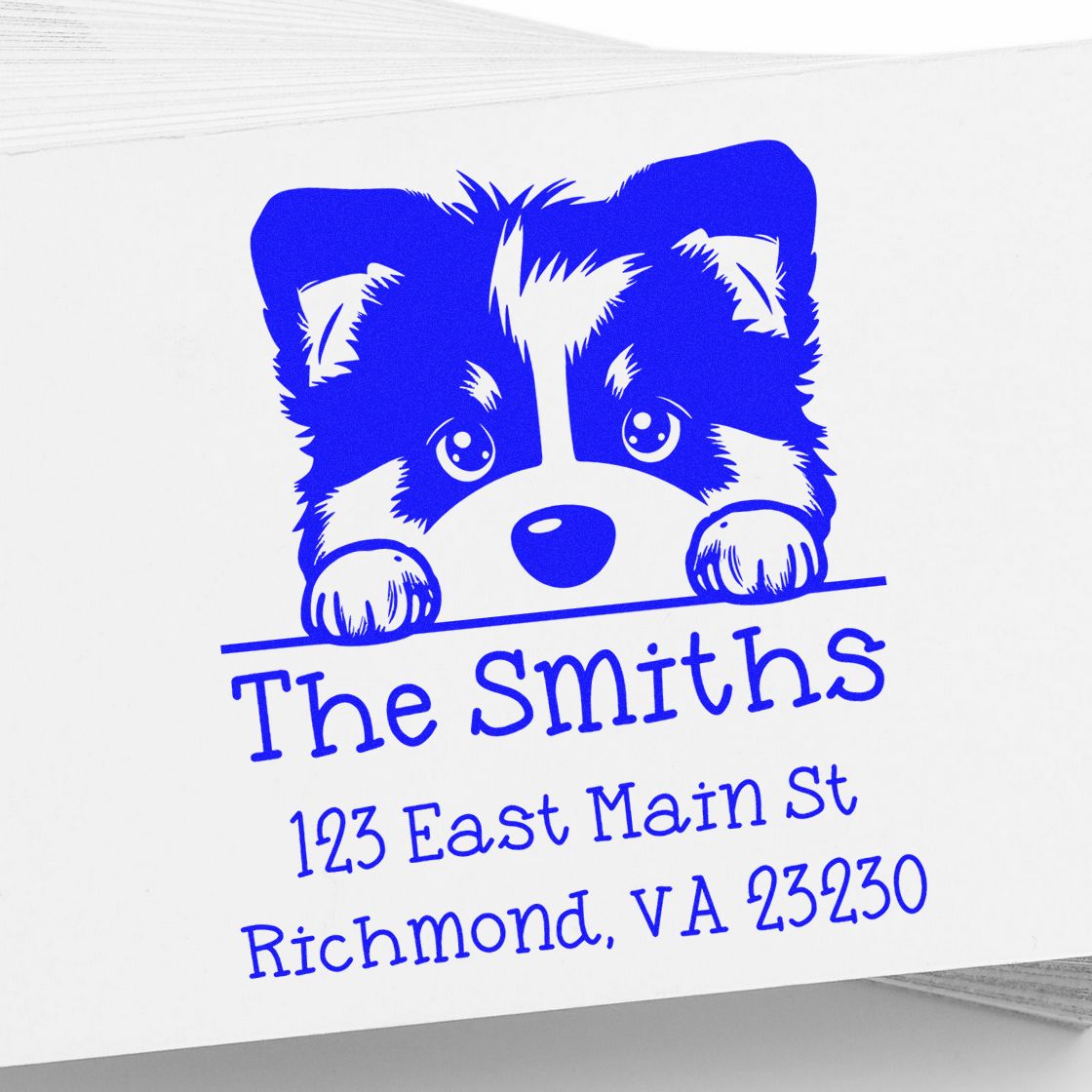 Blue custom return address stamp with puppy peeking over line, reading The Smiths, 123 East Main St, Richmond, VA 23230
