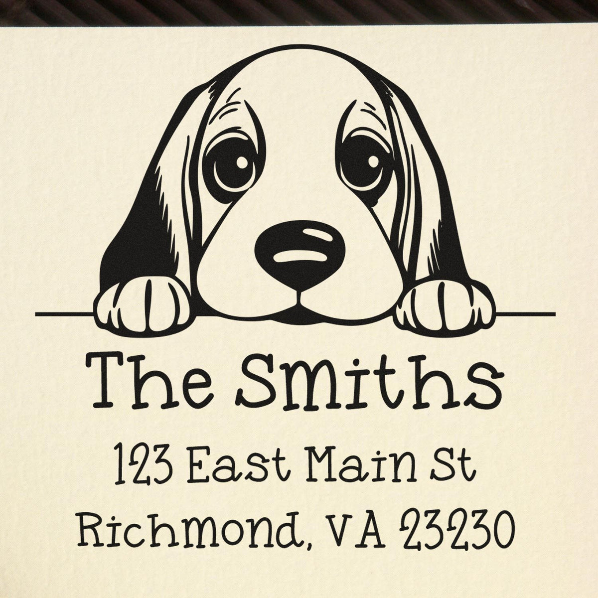 Black custom stamp/seal with a puppy graphic on cream background; The Smiths, 123 East Main St, Richmond, VA 23230.