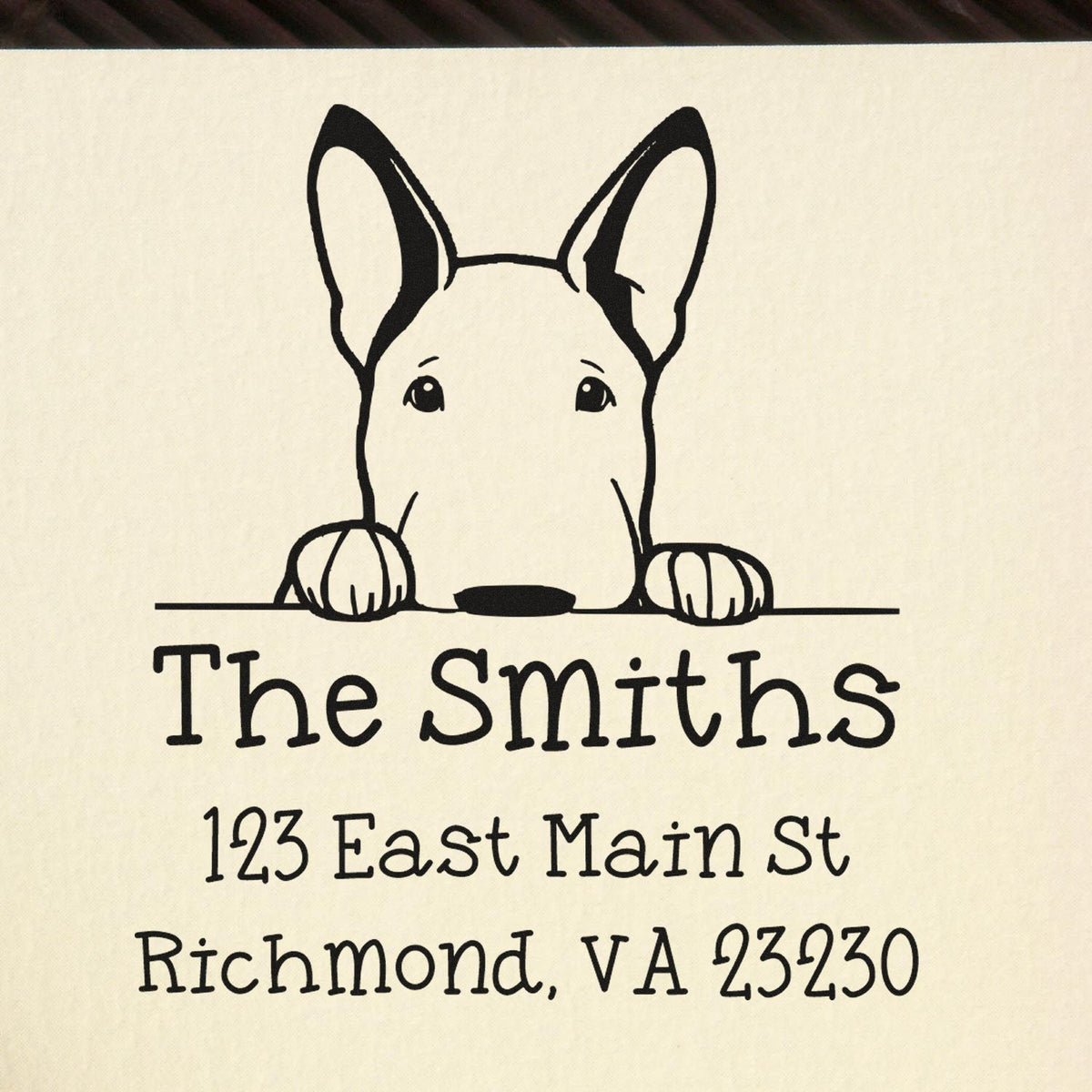 Black custom stamp and seal with dog logo, The Smiths, and Richmond, VA address on cream background