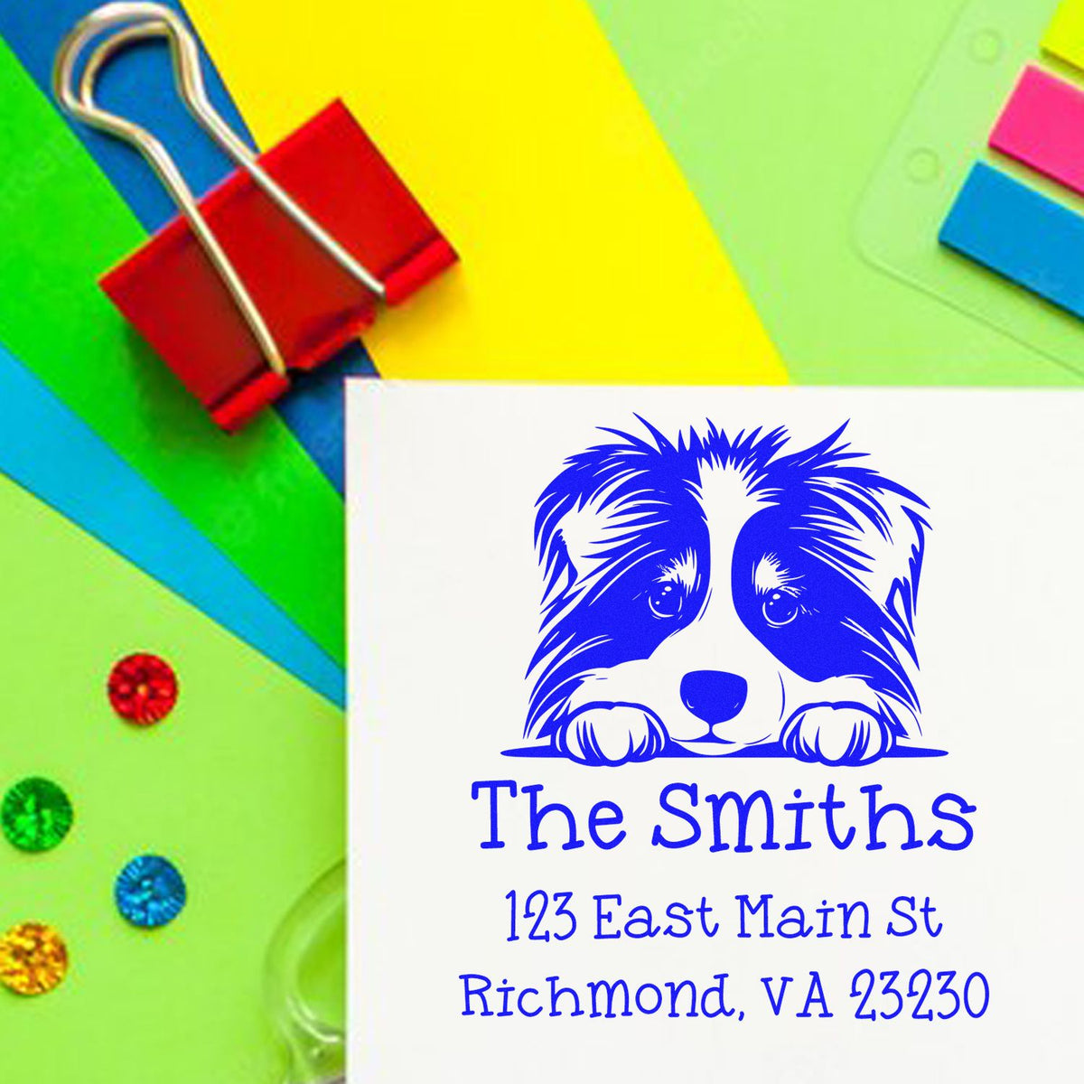 Custom blue dog address stamp and seal with The Smiths and Richmond, VA on white card, colorful stationery background