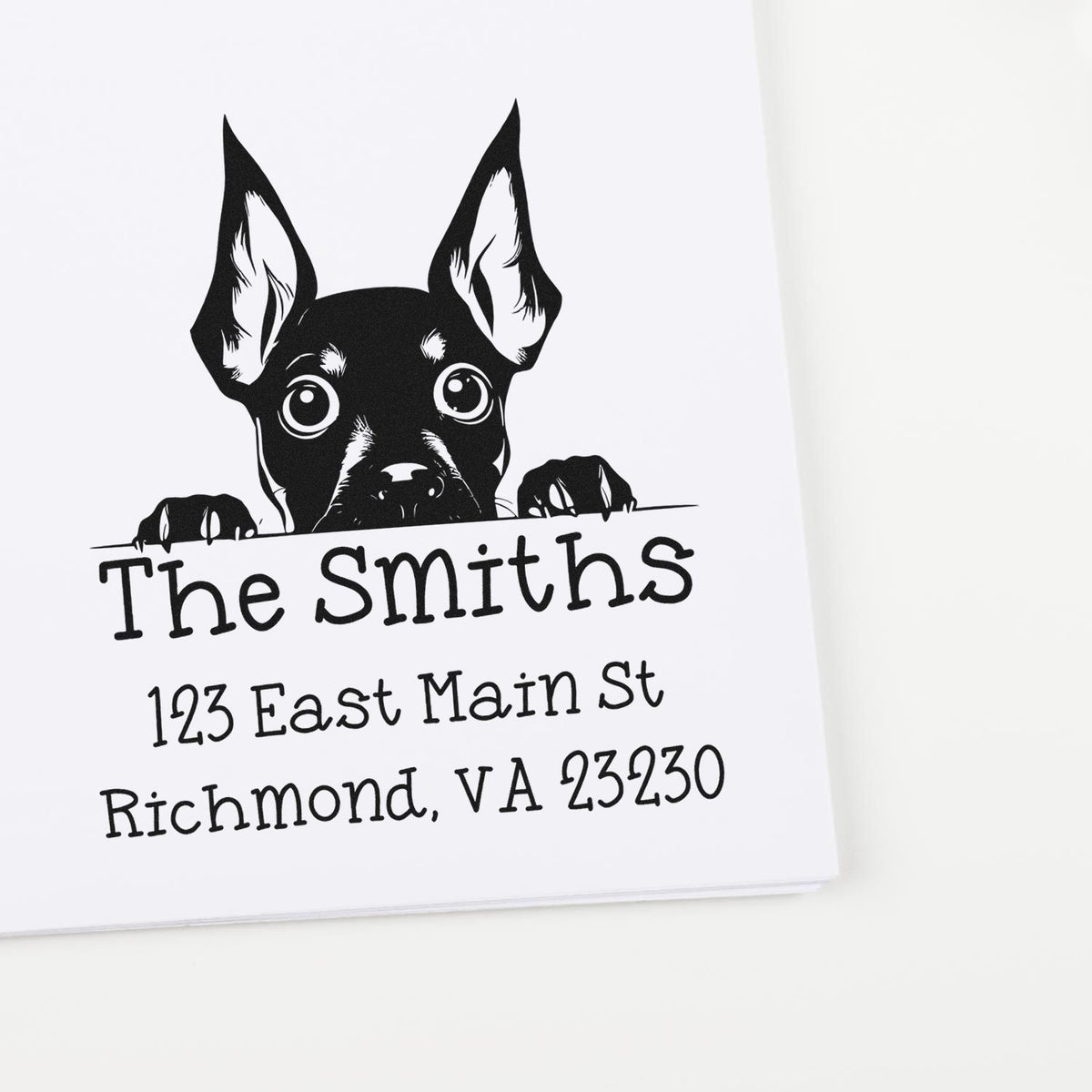 Black custom address stamp with peeking dog seal for The Smiths, showing Richmond, VA address on white background.