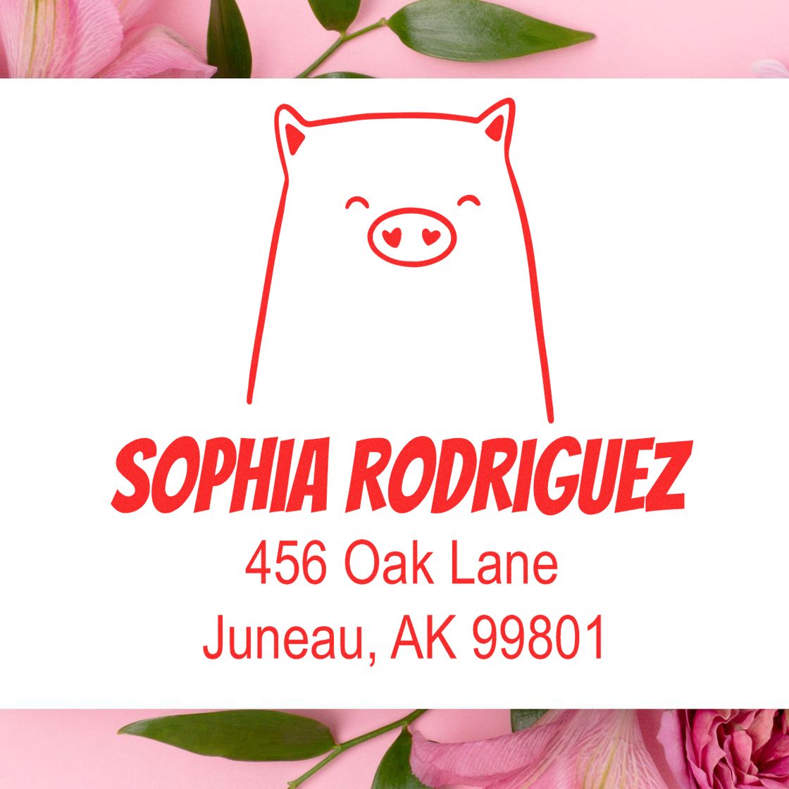 Cheery Pig Pre-Inked Customized Mailing Stamper with a red pig illustration and heart-shaped nose. Below, "Sophia Rodriguez, 456 Oak Lane, Juneau, AK 99801" is displayed, showcasing a Customized Address Stamp on a pink floral background.