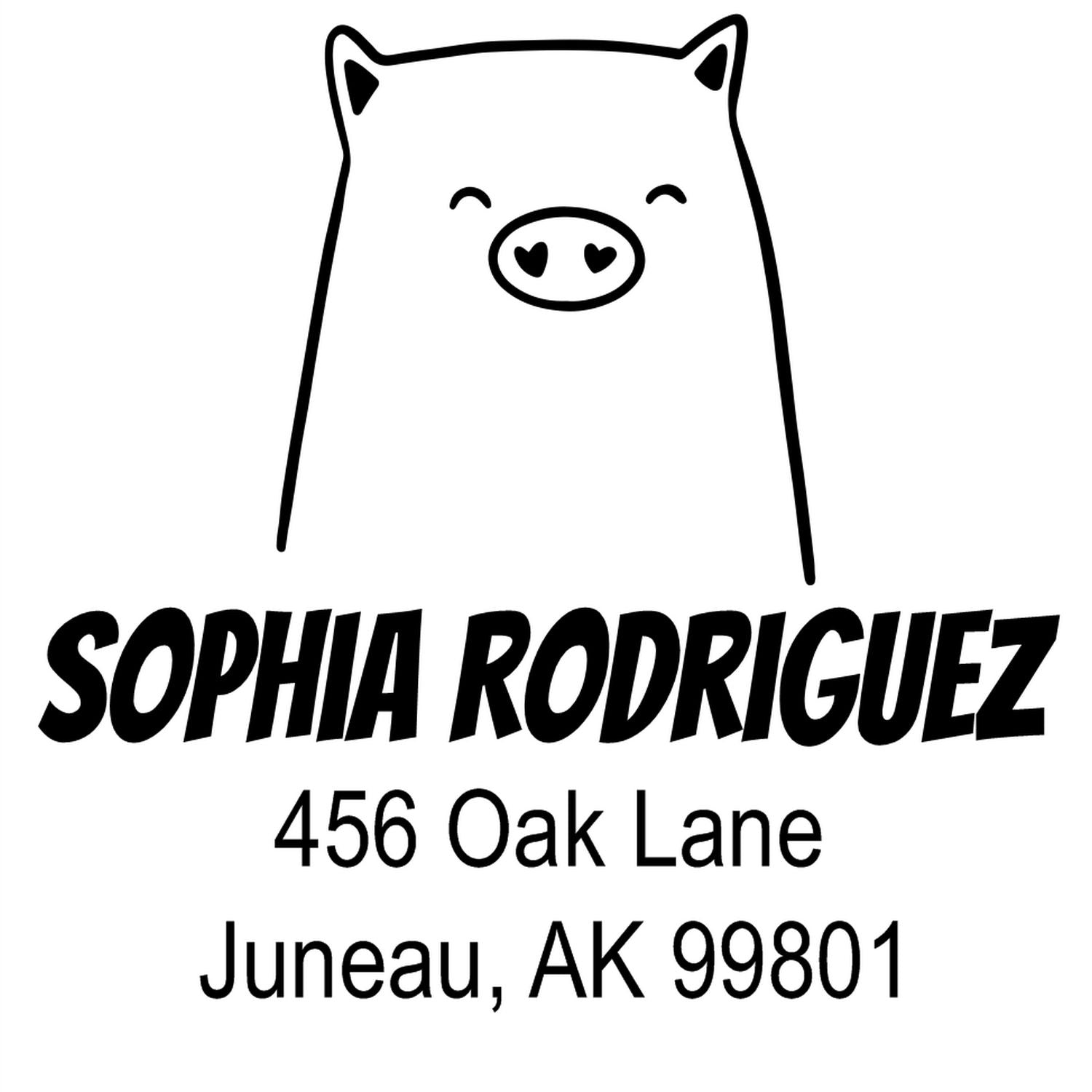 Wood handle cheery pig cartoon animal made to order address stamper featuring a smiling pig design. Custom-made address stamper with bold text displaying "Sophia Rodriguez, 456 Oak Lane, Juneau, AK 99801" below the pig illustration.