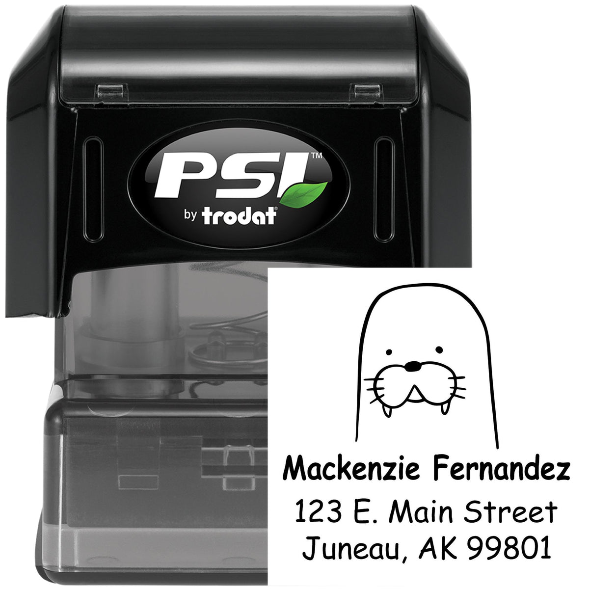 Image of a Wacky Walrus Pre-Inked Customized Return Address Stamp featuring a walrus illustration. The Custom Home Stamp displays the name Mackenzie Fernandez with an address in Juneau, AK. The stamp is black with a PSI by Trodat logo.