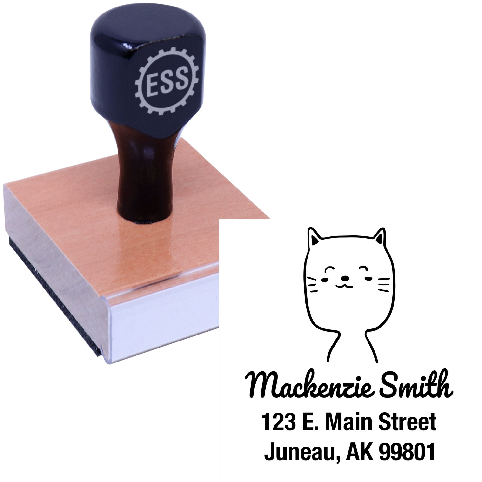 Wood handle custom mail stamp featuring a charming cat cartoon animal design. The stamp displays "Mackenzie Smith, 123 E. Main Street, Juneau, AK 99801." Ideal as a custom new address stamper.