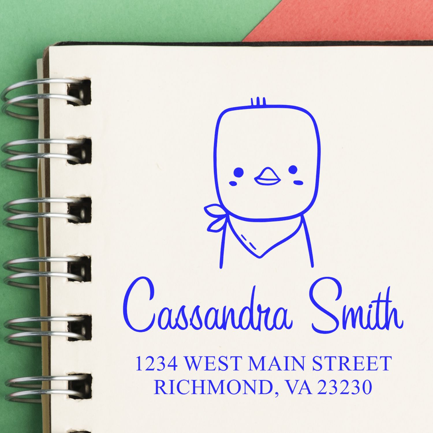 Wood handle cute chick cartoon animal custom envelope stamp with a custom new address stamp design featuring a simple chick illustration and personalized address details on a spiral notebook page.