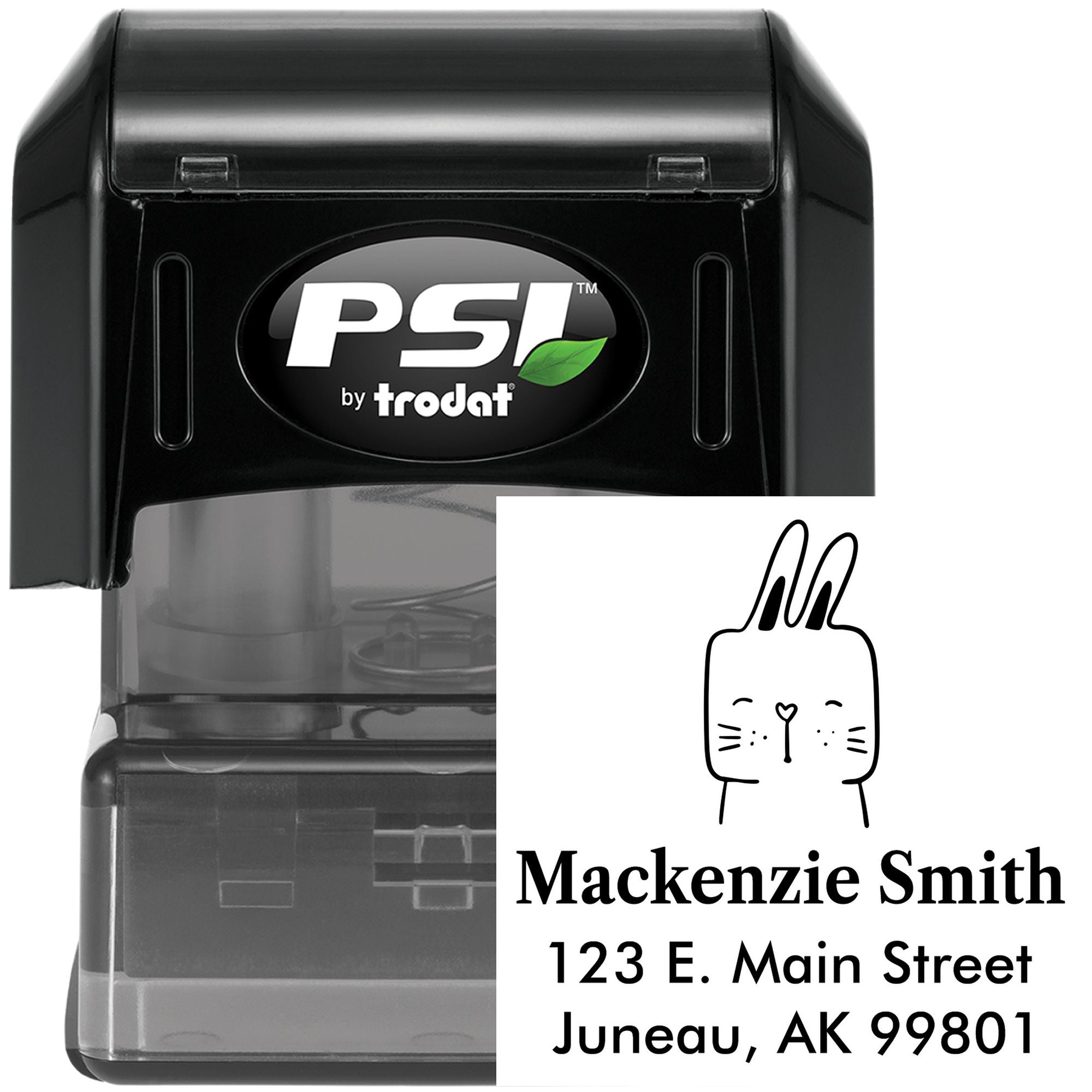 Fuzzy Rabbit Pre-Inked Handcrafted Address Stamp featuring a customizable address design with a cute rabbit illustration. The stamp displays the name "Mackenzie Smith" and an address in Juneau, AK. The black casing is branded with "PSI by Trodat."