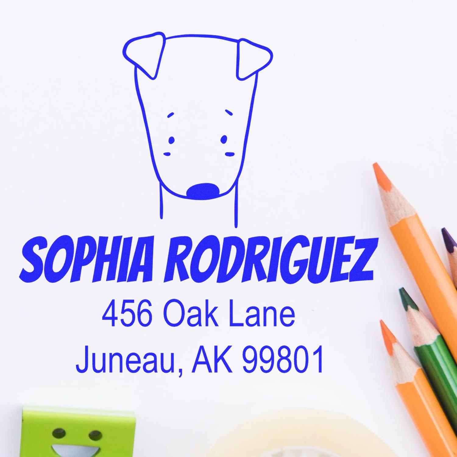 Wood Handle Daring Dog Cartoon Animal Custom Return Address Stamp featuring a cute dog illustration above the name "Sophia Rodriguez" and address "456 Oak Lane, Juneau, AK 99801." Colored pencils and a green eraser are nearby, showcasing a Customized Home Stamp.