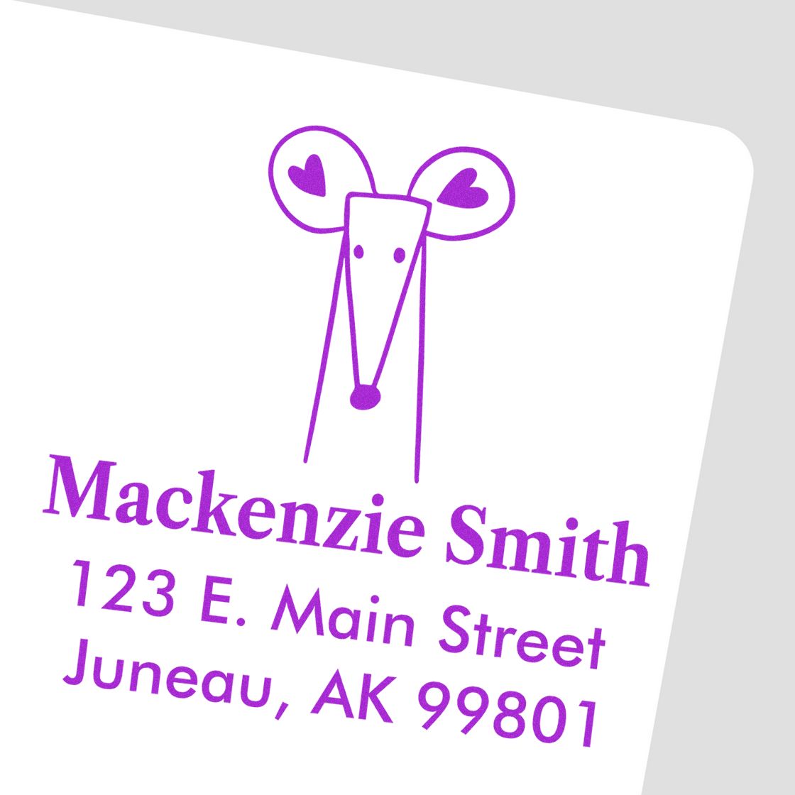 Wood Handle Mighty Mouse cartoon animal design on a custom-made return mail stamp. The stamp features a home address: Mackenzie Smith, 123 E. Main Street, Juneau, AK 99801, in purple text with a playful mouse illustration.