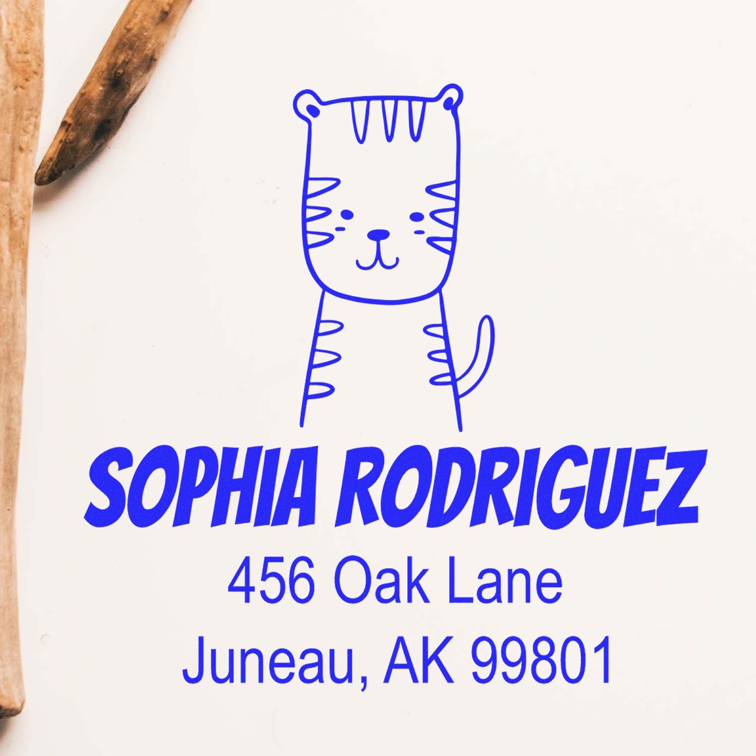 Wood Handle Terrific Tiger Cartoon Animal Custom Return Address Stamper featuring a cute tiger design. The stamp displays "Sophia Rodriguez, 456 Oak Lane, Juneau, AK 99801" in blue. Ideal for a customized home stamp.