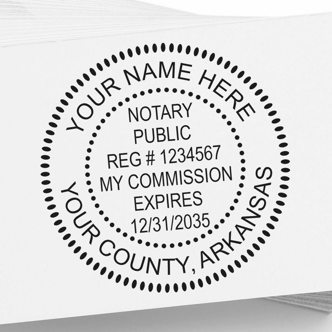Black notary public seal stamp in black on white paper, with custom name, registration number, and Arkansas county.