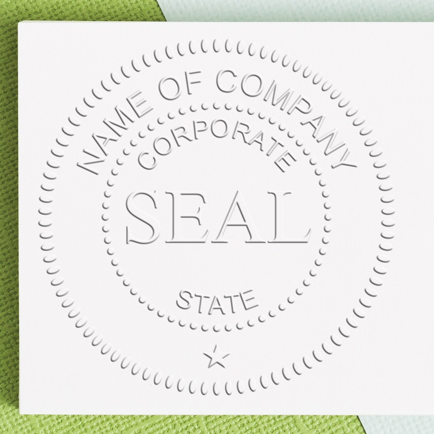 Embossed white corporate seal stamp with dotted circular border on white paper over green textured background.