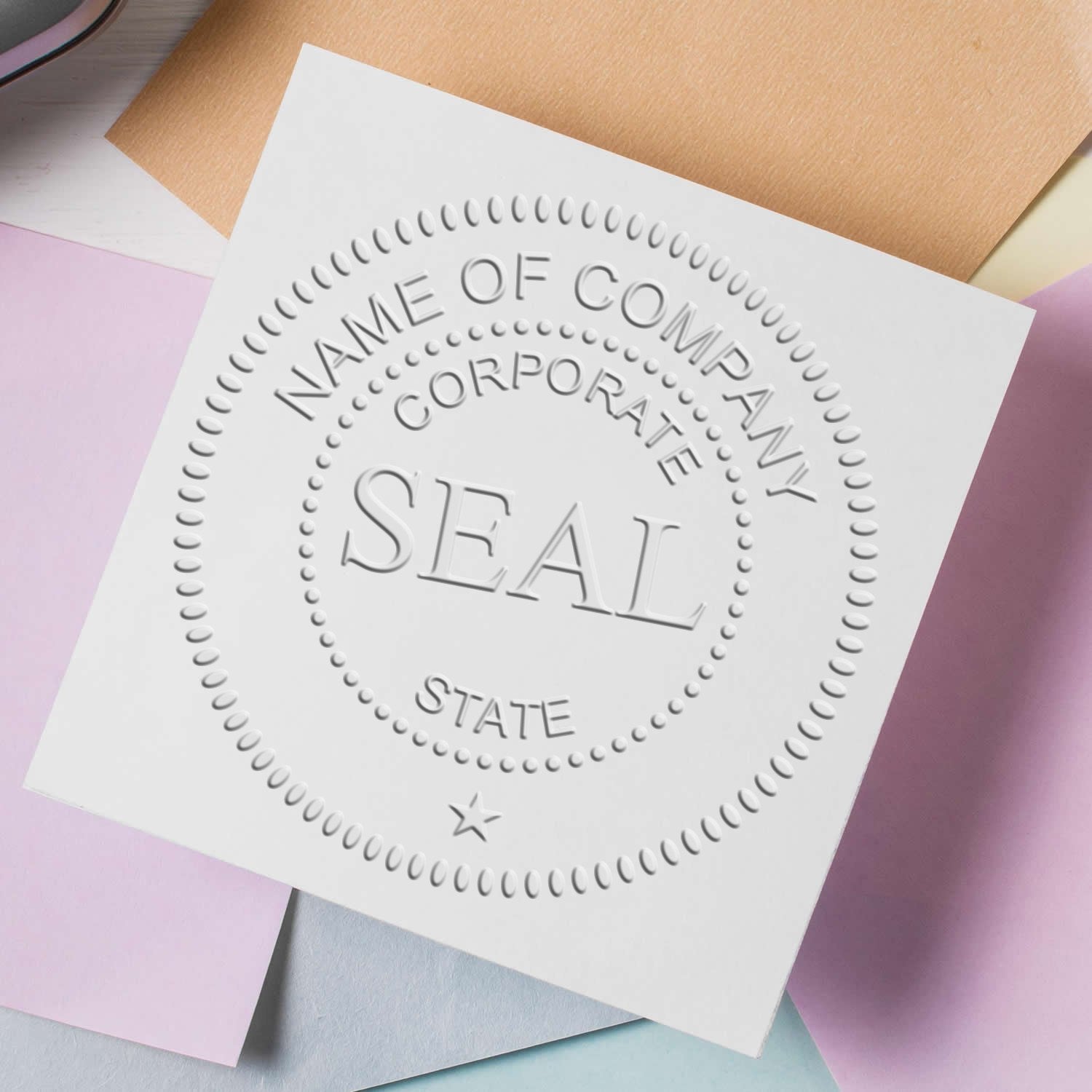 White embossed corporate seal stamp with dotted border on pastel paper sheets.