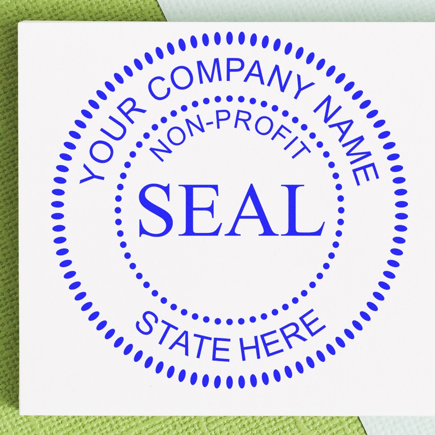 Blue nonprofit company seal stamp on white paper with dotted circular border and placeholder text.