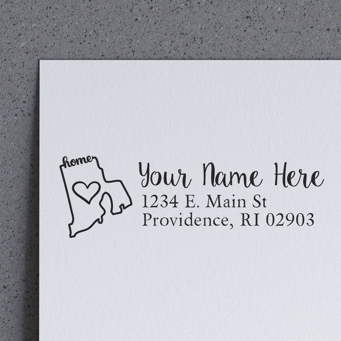 Rhode Island state love rubber address stamp with wood handle by ESS, showing the stamp in use for custom return addresses.