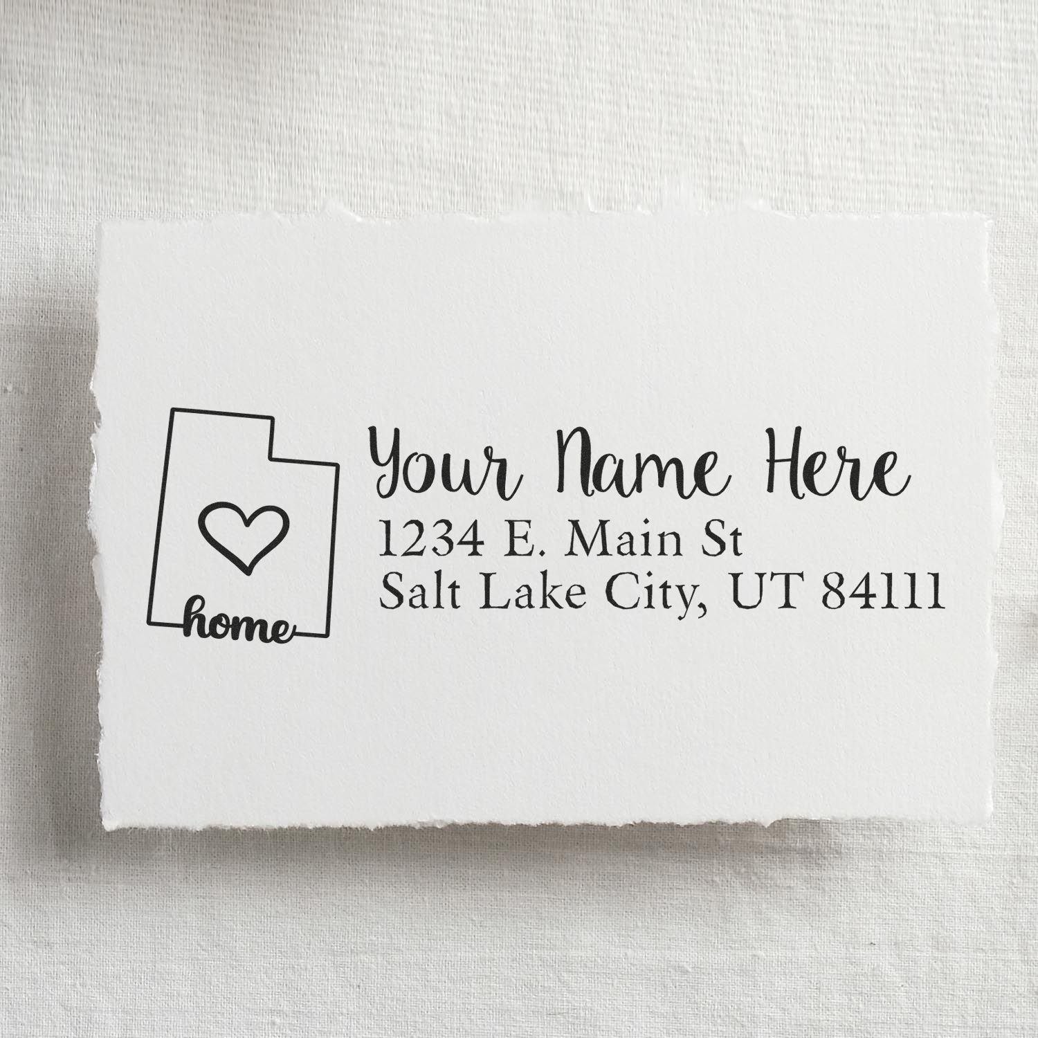 Utah Self-Inking State Love Address Stamp on white paper, featuring a heart design and sample address: Your Name Here, 1234 E. Main St, Salt Lake City, UT 84111.