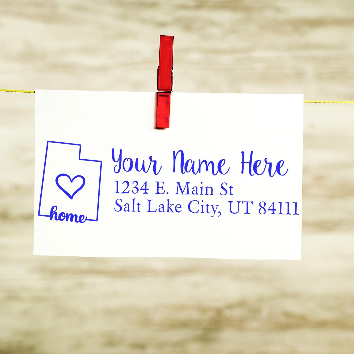 Utah state love rubber stamp with wood handle from ESS, showing the custom return address design in use.