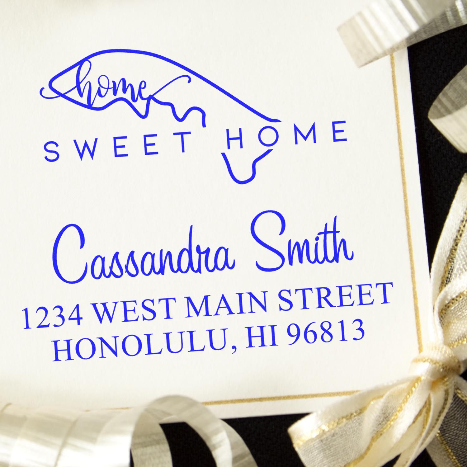 Blue custom address stamp seal with Sweet Home, Cassandra Smith, and Honolulu, HI 96813 on a white card.