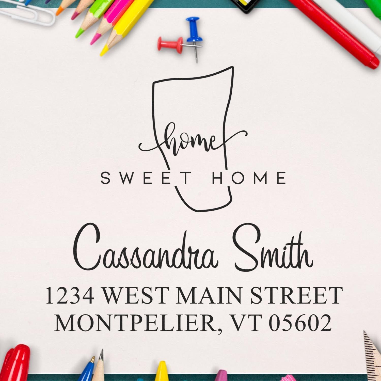 Custom stamp and seal design in black on white, with colorful pencils and push pins around a Sweet Home return address.