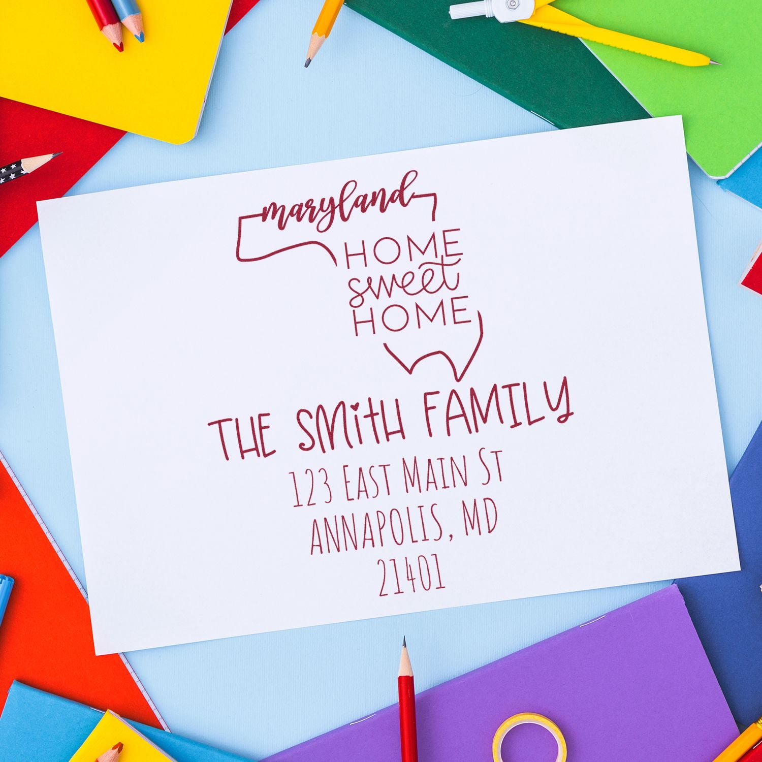 Red Maryland home sweet home custom stamp/seal with The Smith Family and Annapolis, MD, on white paper.