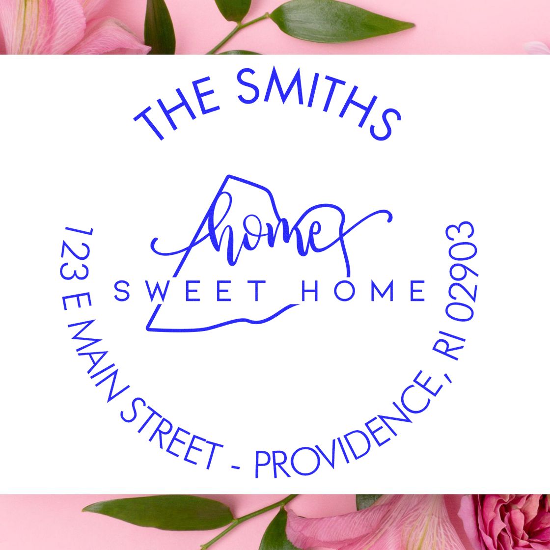 Blue circular address stamp seal for The Smiths Sweet Home, with home icon and 123 E Main Street, on white with pink florals.