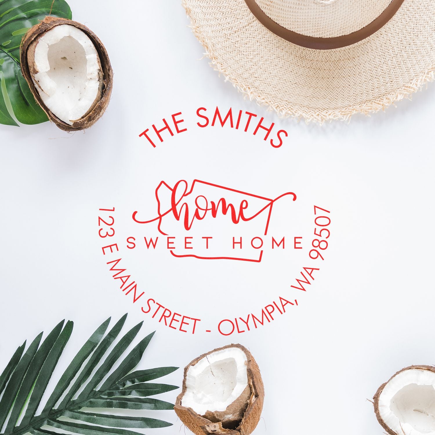 Red custom home address stamp and seal design on white background with tropical leaves, coconut halves, and straw hat.