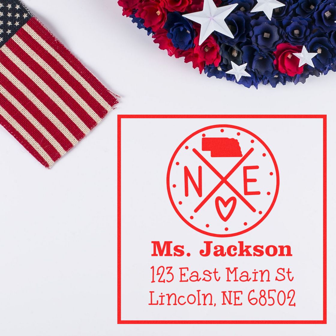 Red custom address stamp and seal for Ms. Jackson, with Lincoln, NE address, on white background with red, white, and blue decor.