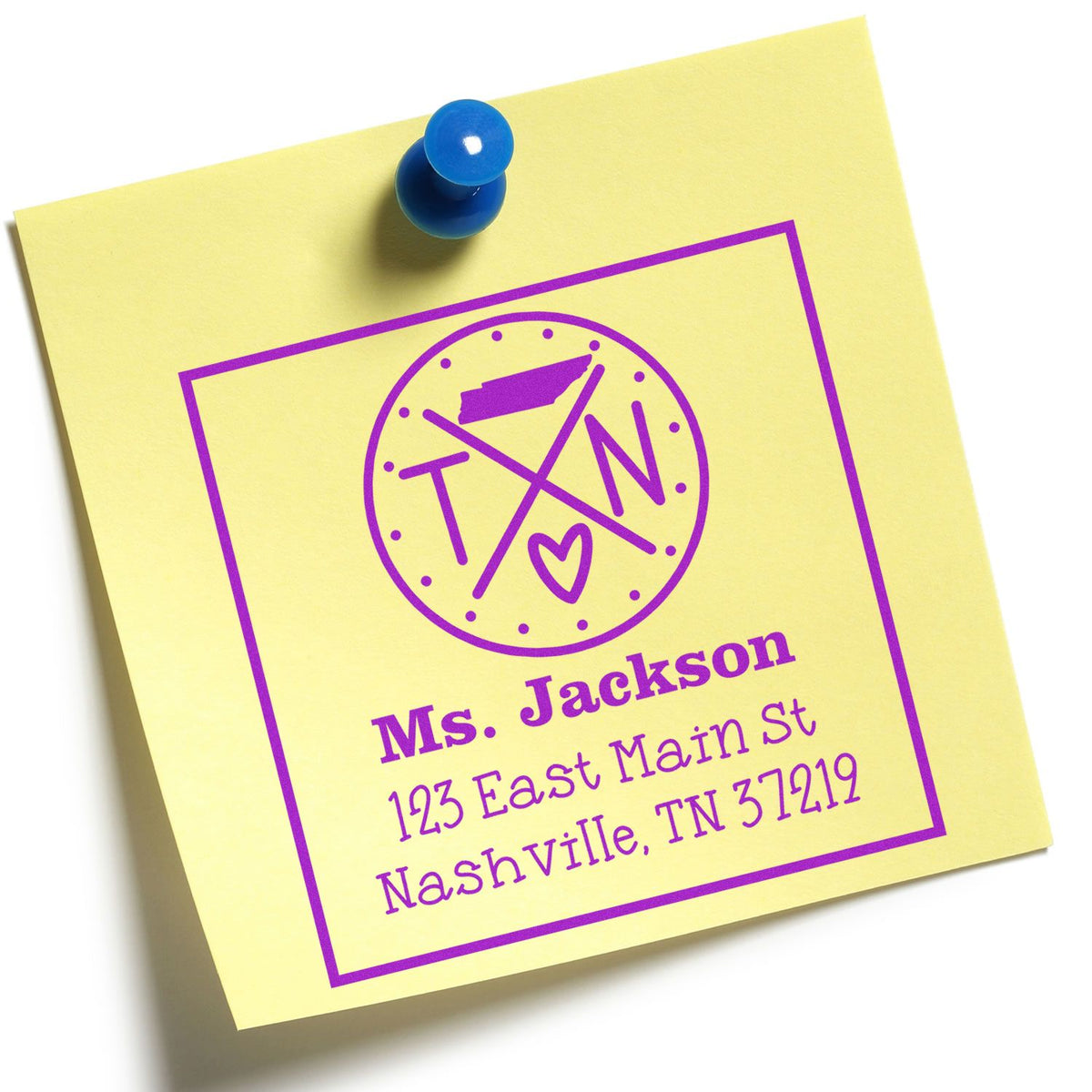 Yellow note with blue push pin and purple custom stamp seal reading Ms. Jackson, 123 East Main St, Nashville TN 37219.