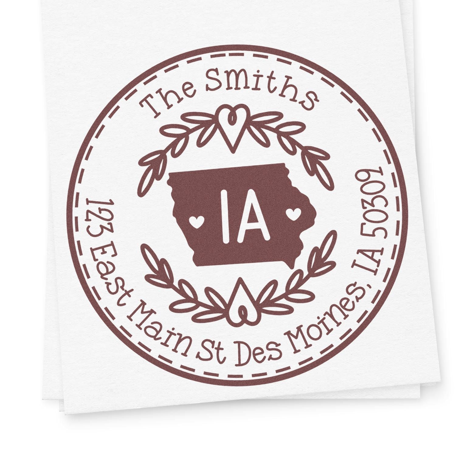 Brown circular custom stamp seal with Iowa outline, hearts, laurel wreath, and The Smiths text on white paper.