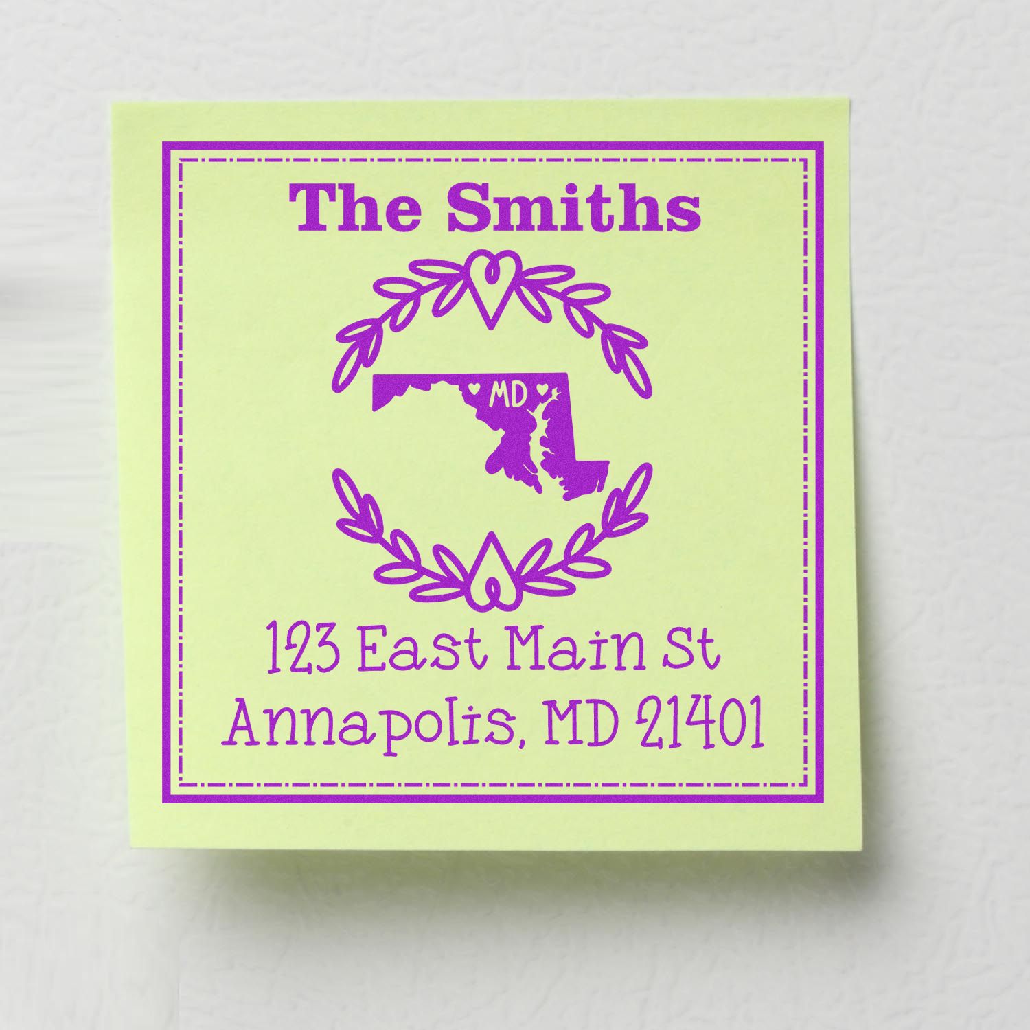 Custom purple return address stamp seal on pale green paper with The Smiths, Maryland map, laurel wreath, and address.