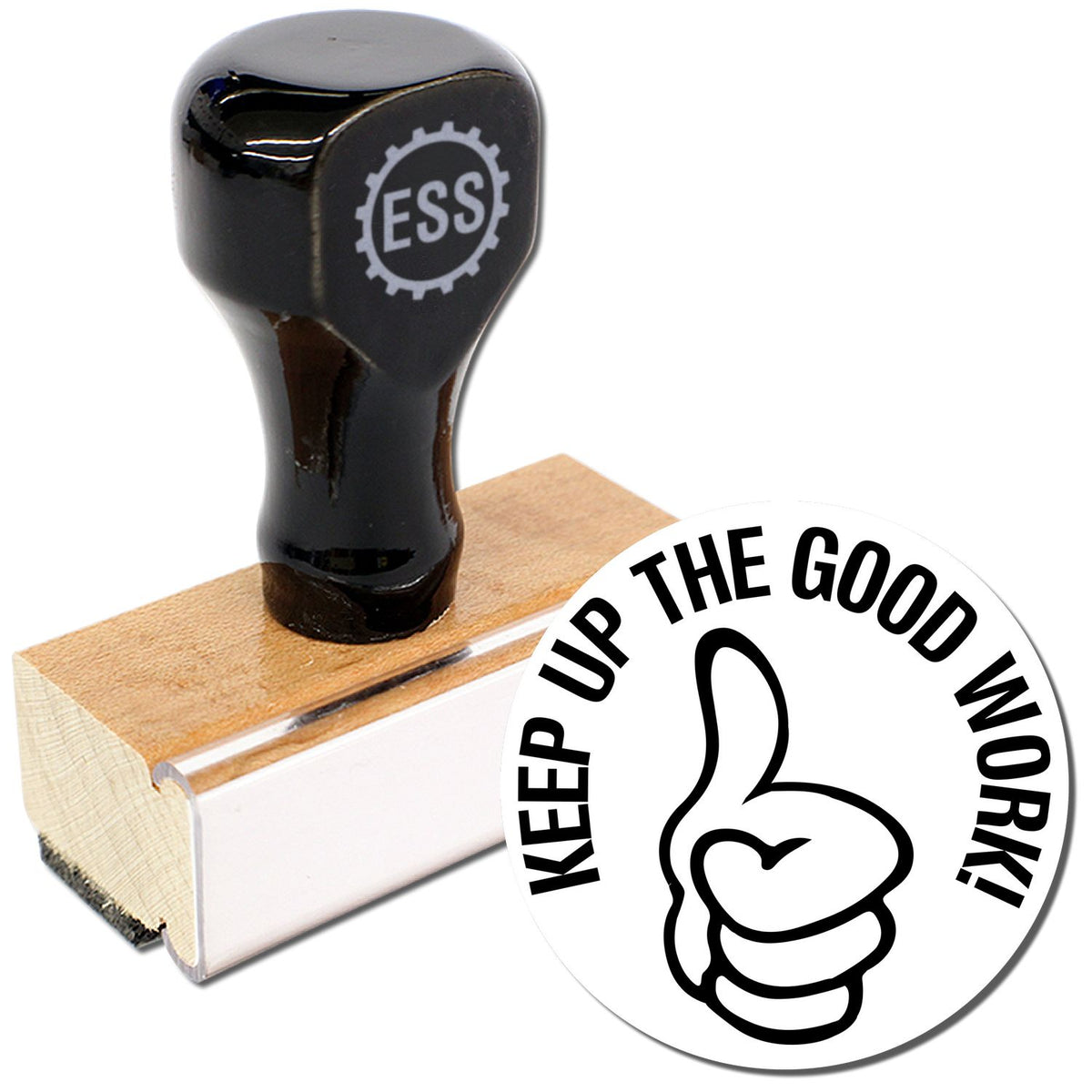 A stock office rubber stamp with a stamped image showing how the text &quot;KEEP UP THE GOOD WORK&quot; in a round shape with a thumbs-up symbol is displayed after stamping from it.