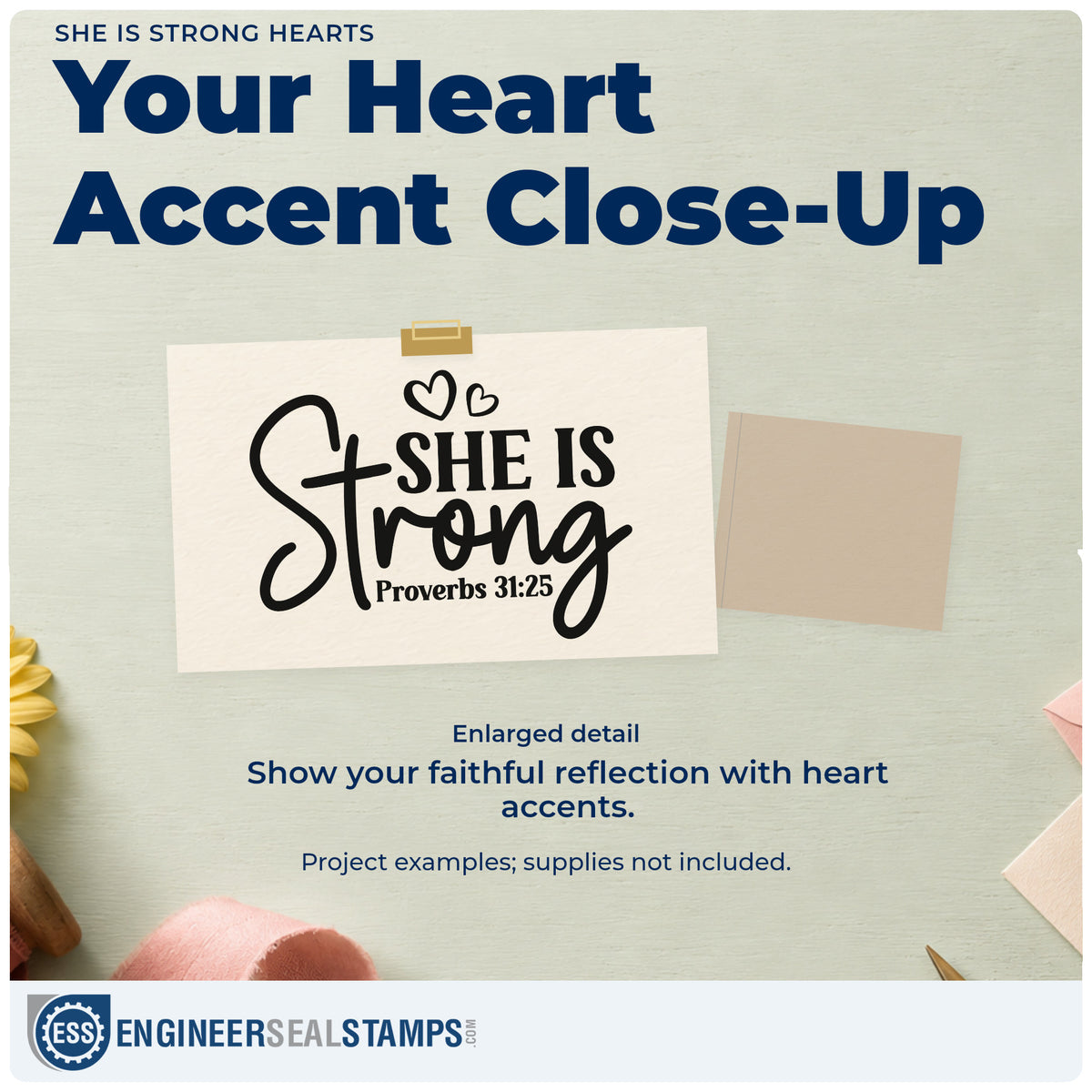 Enlarged detail of the She Is Strong Heart Accents Self-Inking Stamp imprint. Bold and flowing "She is strong" lettering is accented by hearts and Proverbs 31:25.