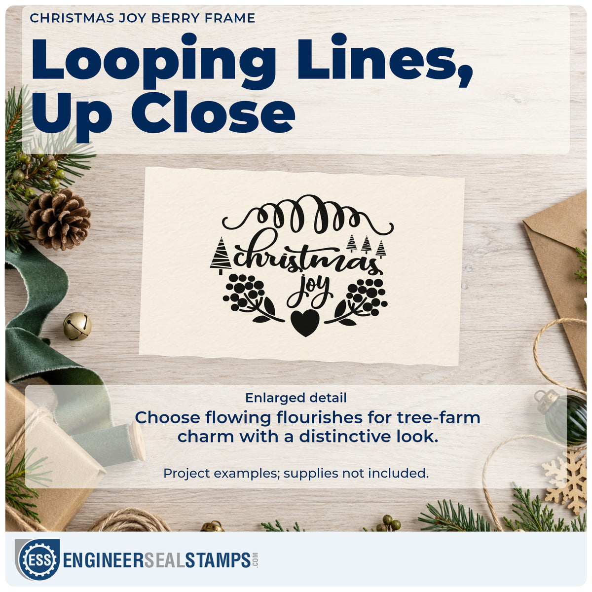 Enlarged detail of the Christmas Joy Berry Frame Self-Inking Stamp imprint. “Christmas Joy” appears between a looping flourish, tiny trees, berry branches, and a heart.