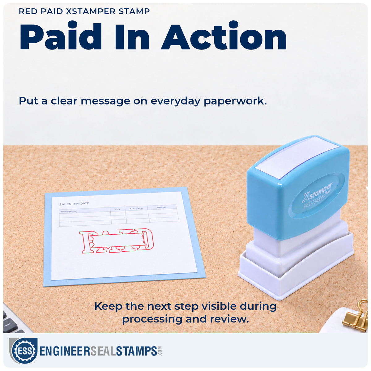 "Paid" stamp being pressed onto a document during everyday filing