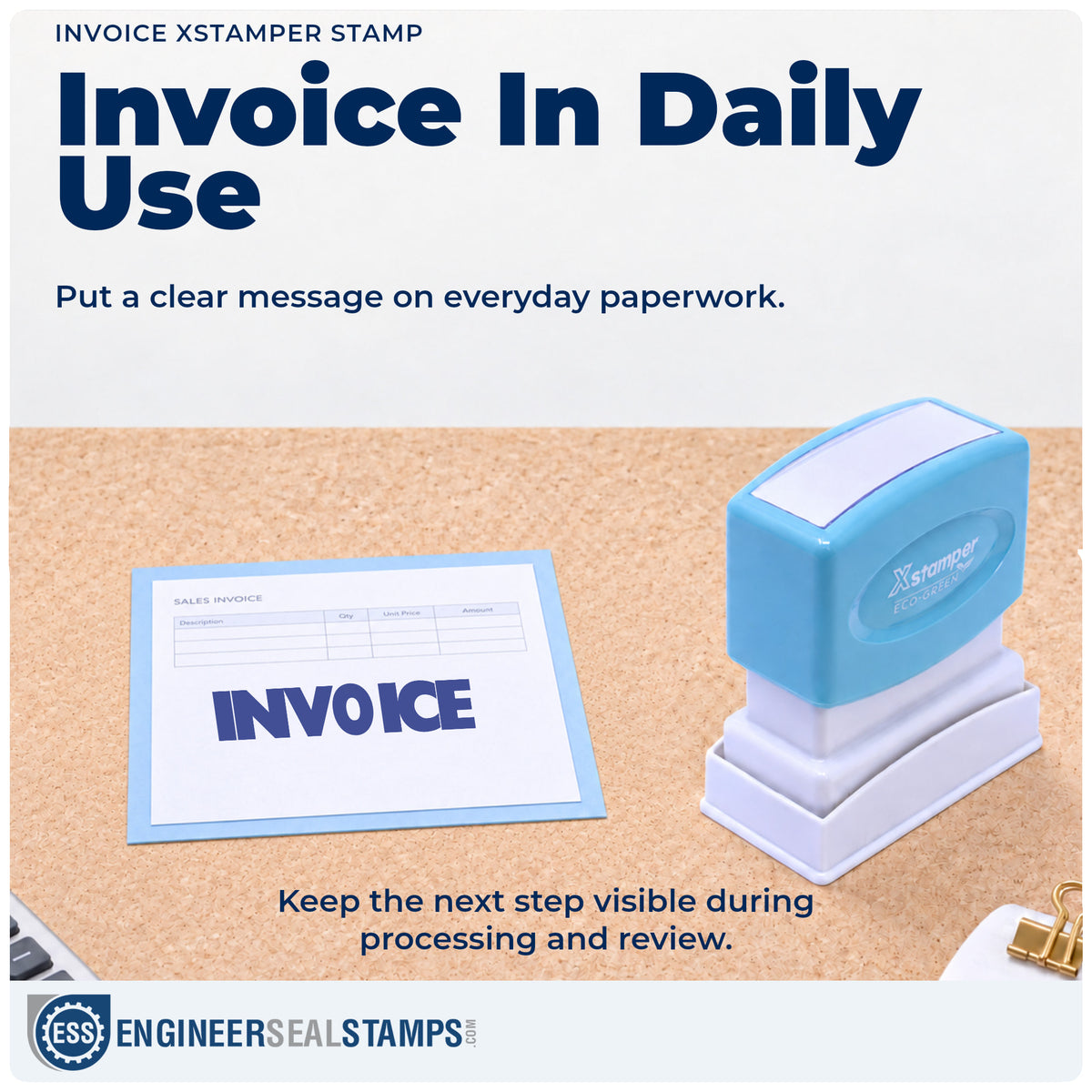 "Invoice" stamp being pressed onto a document during everyday filing