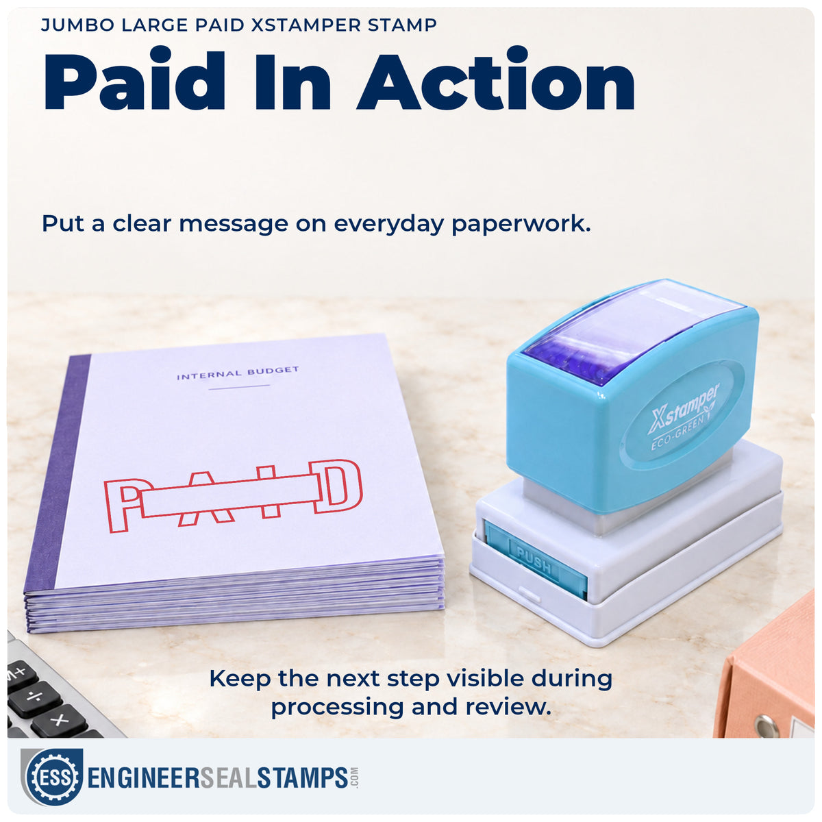 "Paid" stamp being pressed onto a document during everyday filing