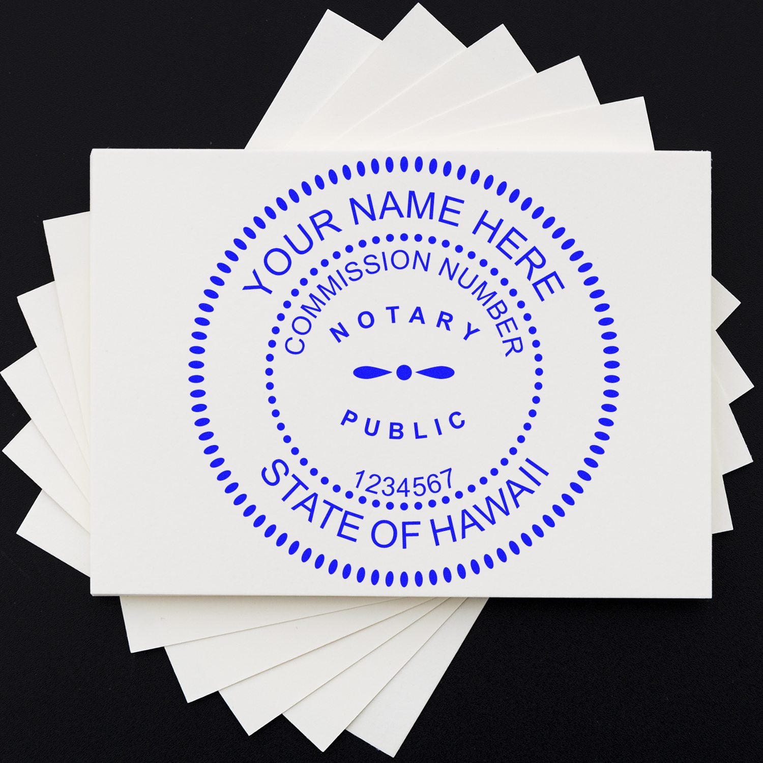 White notary stamp and seal sample with blue circular text on layered white cards against a black background.