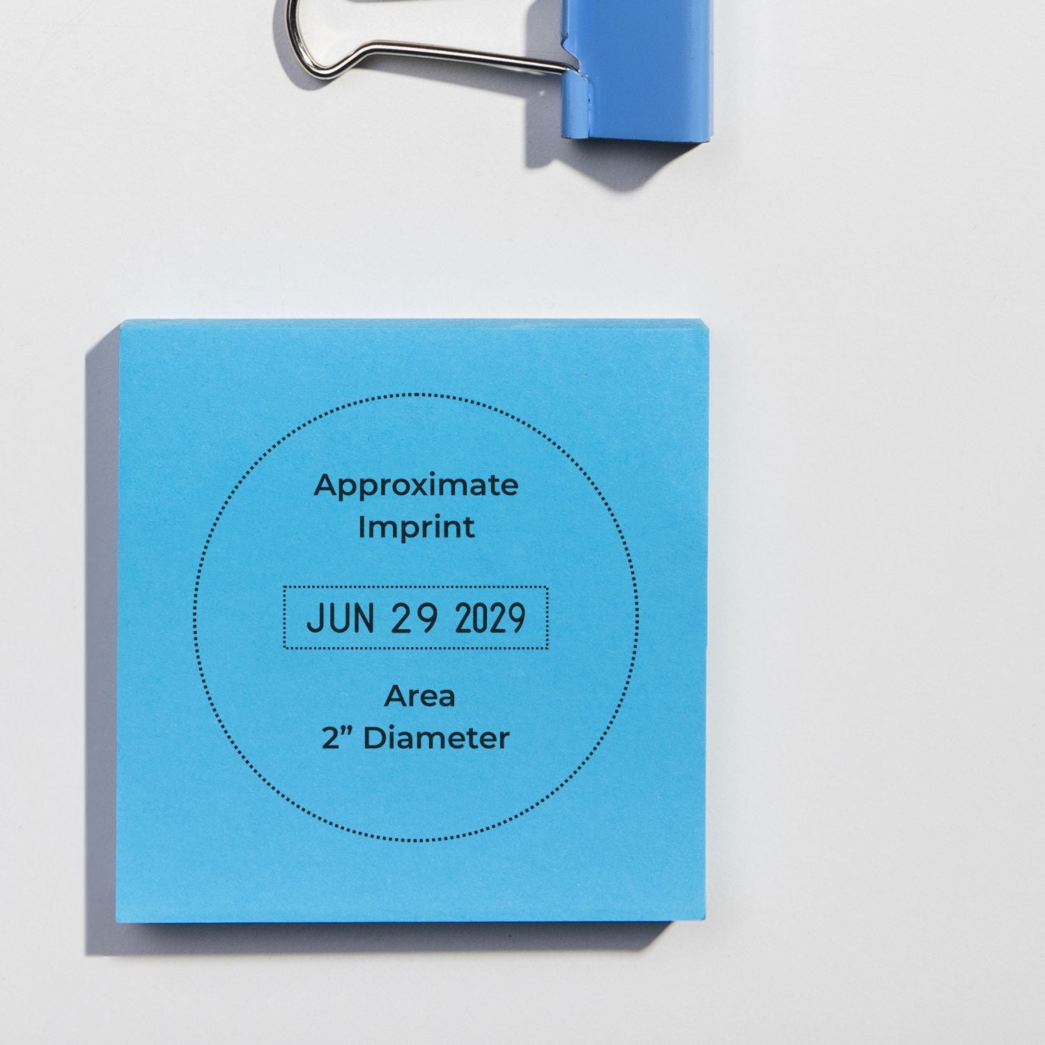 Blue stamp seal template card with dotted 2-inch round imprint area, JUN 29 2029, and a blue binder clip at top.